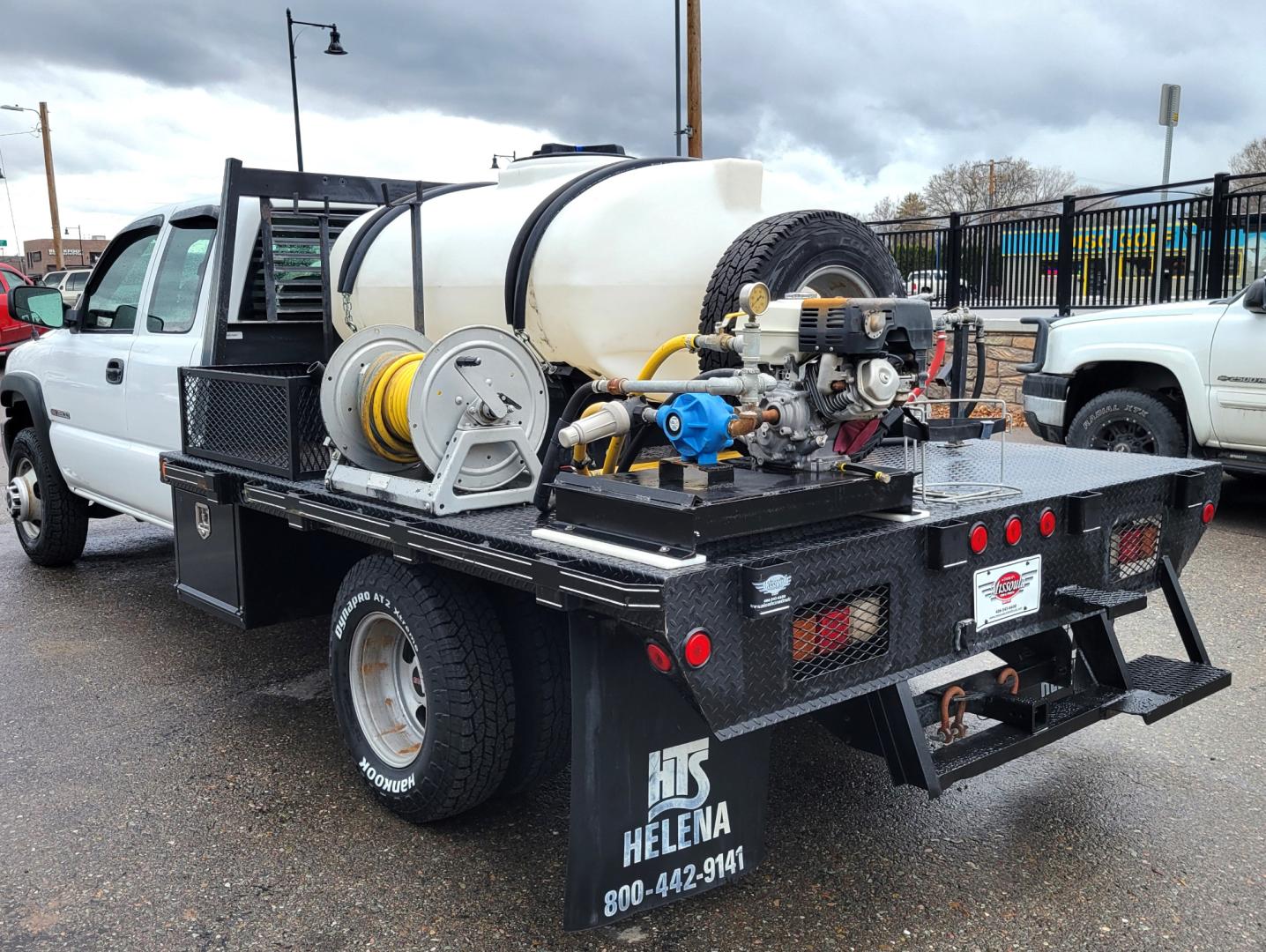 2005 White /Black GMC Sierra 3500 Ext. Cab 4WD (1GDJK39G65E) with an 8.1L V8 OHV 16V engine, Automatic transmission, located at 450 N Russell, Missoula, MT, 59801, (406) 543-6600, 46.874496, -114.017433 - One Owner Beast of a Truck. 8.1l v8 Engine. 4 Wheel Drive. Automatic Transmission. Dual Rear Tires. Air Conditioning. AM FM. Water Tank. 8hp Honda {Pump with two Hose Reels and Sprayers. - Photo#5